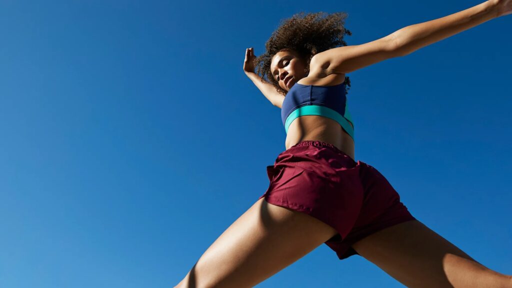 A person engaged in a workout routine at a gym, showcasing dedication and consistency in achieving fitness and health goals.