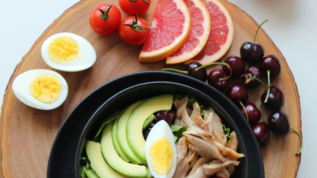 A colorful plate of fresh vegetables, fruits, and grains, representing a clean and balanced eating lifestyle.