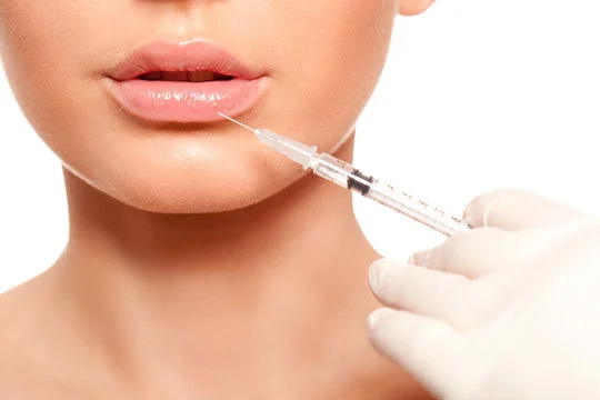 "Close-up of a healthcare professional injecting Botox into a patient's forehead to reduce wrinkles."