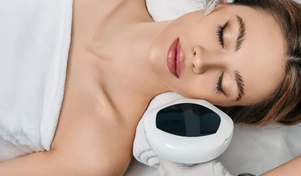 "Teenage girl relaxing during a facial treatment with a soothing mask applied to her face in a tranquil spa setting."